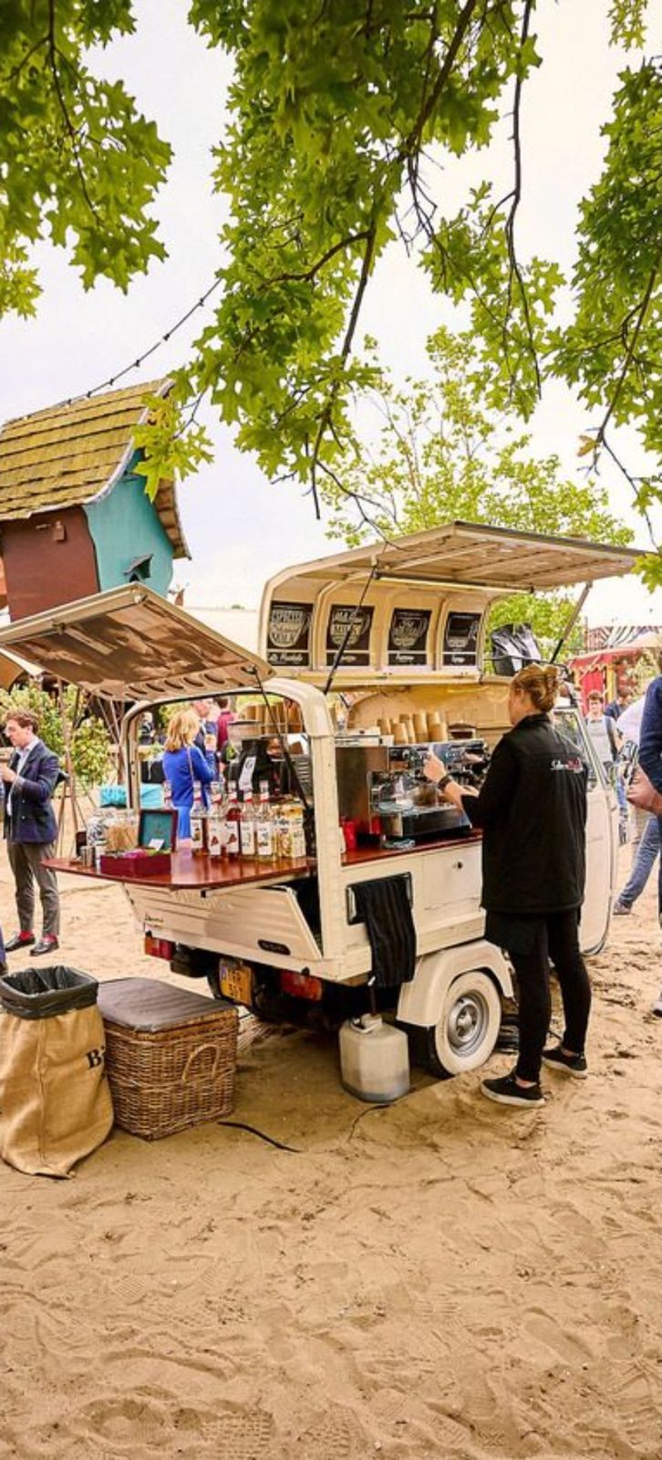 Food cart on sand at an outdoor event